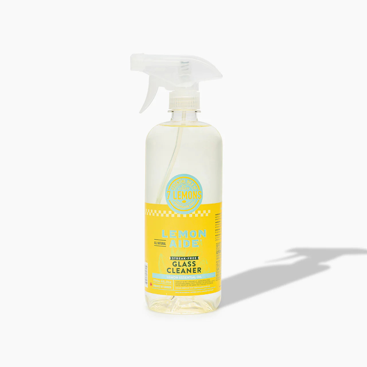 Bottle of lemon-scented glass cleaner on a white background