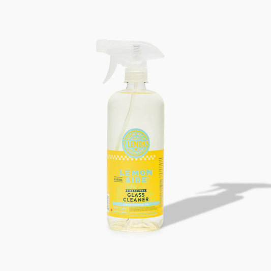 Bottle of lemon-scented glass cleaner on a white background